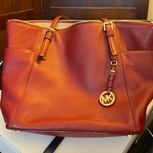 Large Michael Kors bag. Tomato Red. Carry all!!